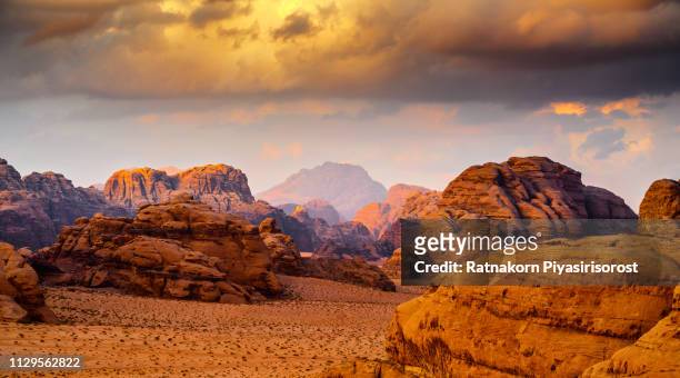 red sand dune and amazing rock in wadi rum desert, jordan - jordanien stock-fotos und bilder