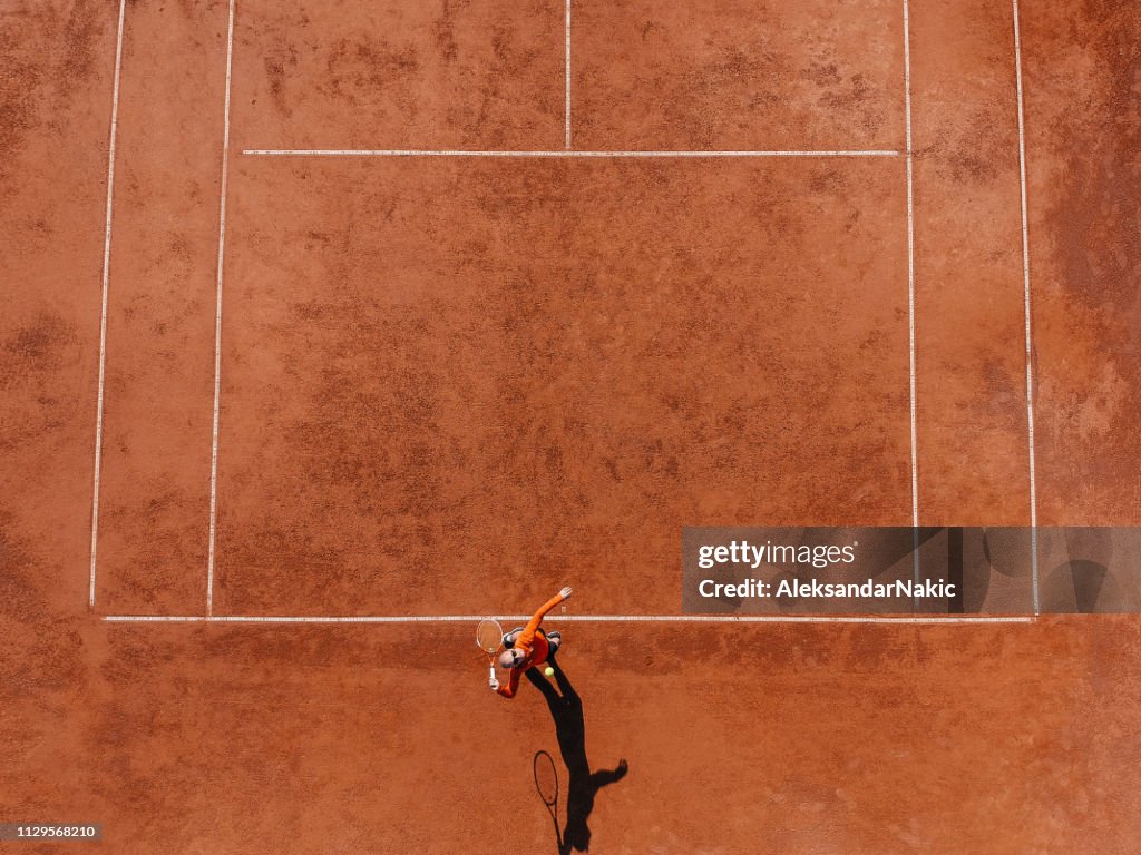 Tennis player on a tennis court during the match