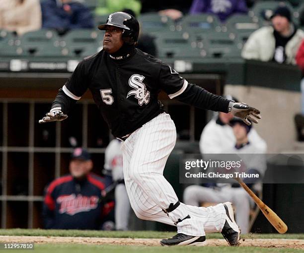Chicago White Sox Juan Uribe watches his solo home run in the eighth inning of 3-0 win over the Minnesota Twins at US Cellular Field in Chicago,...