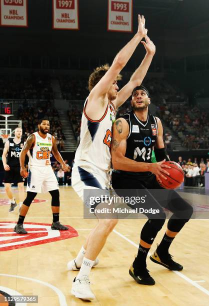 Robert Loe of the Taipans guards Josh Boone of United during the round 18 NBL match between Melbourne United and the Cairns Taipans at Hisense Arena...