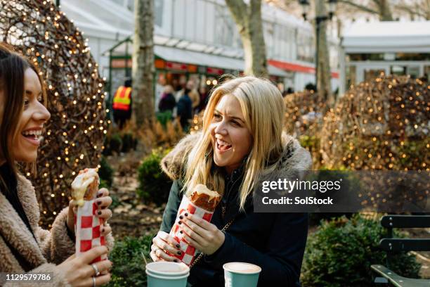 friends enjoying fast food - french food market stock pictures, royalty-free photos & images