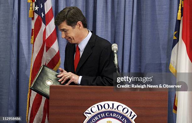 North Carolina State Attorney General Roy Cooper leaves after a press conference at the RBC Center in Raleigh, North Carolina, Wednesday April 11...