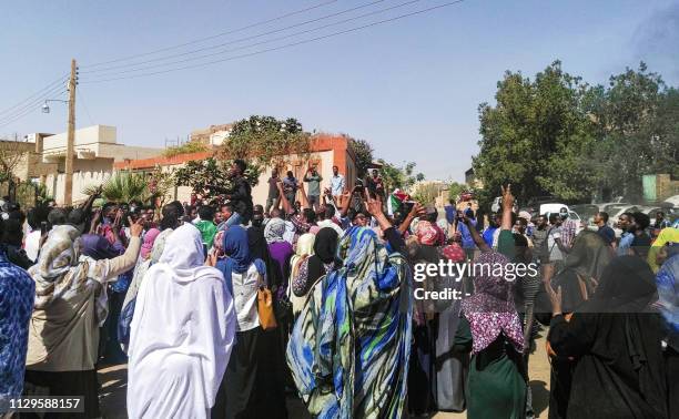 Sudanese protesters chant slogans during an anti-government demonstration in Khartoum's twin city of Omdurman on March 10, 2019. - Sudanese security...