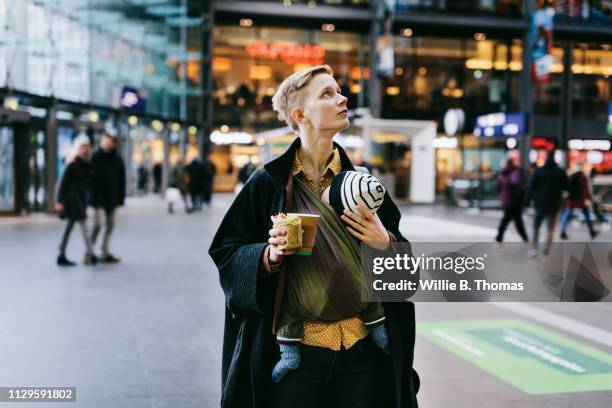 single mother shopping in city with baby - baby on the move stock pictures, royalty-free photos & images