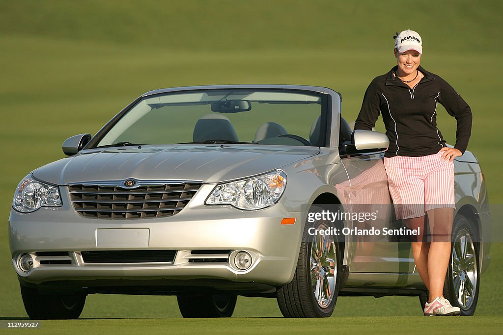 Brittany Lincicome poses with her new Chrysler Sebring after