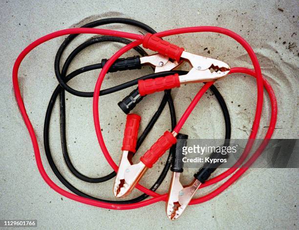 africa, tanzania, 2000: view of car battery jump leads - red car wire stock pictures, royalty-free photos & images