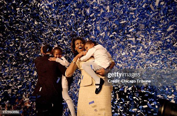 Senator elect Barack Obama of Illionis shares a moment with his wife, Michelle, and children during a victory party at the Hyatt Regency in Chicago,...