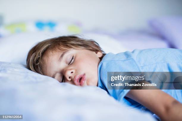 2 year old boy sleeping - kid day dreaming stock pictures, royalty-free photos & images
