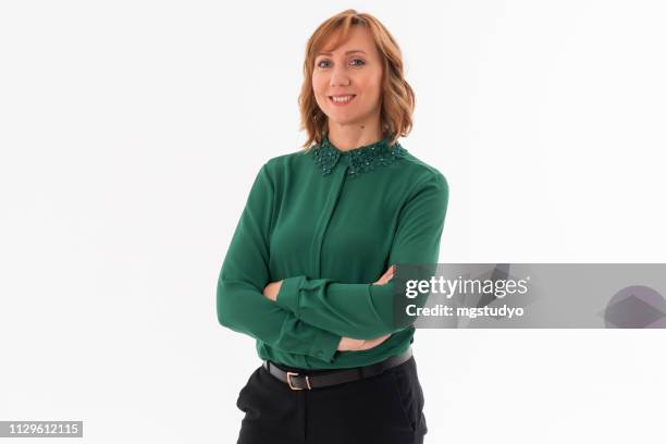 woman posing on white background - green shirt stock pictures, royalty-free photos & images