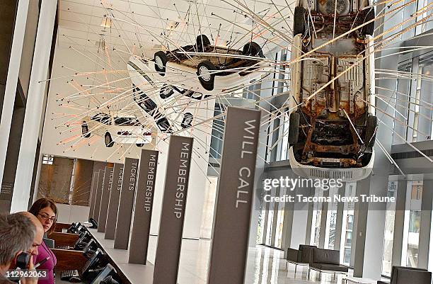 The Seattle Art Museum's new main lobby, called "The Forum", has a sculpture of hanging cars called "Inopportune Stage One" by Cai Gui-Qiang. The...