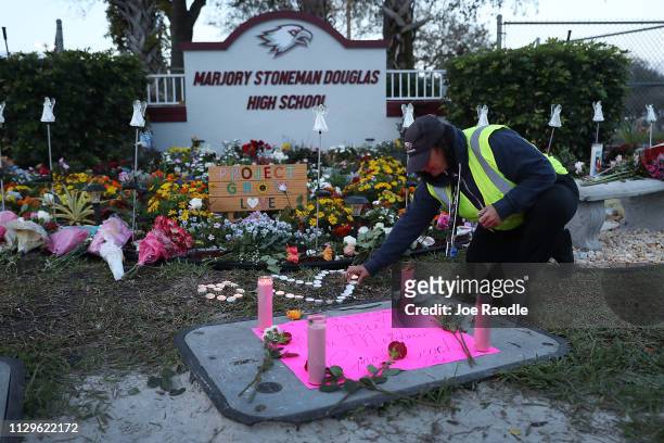Wendy Behrend, a school crossing guard who was on duty one year ago when a shooter opened fire in Marjory Stoneman Douglas High School pays her...