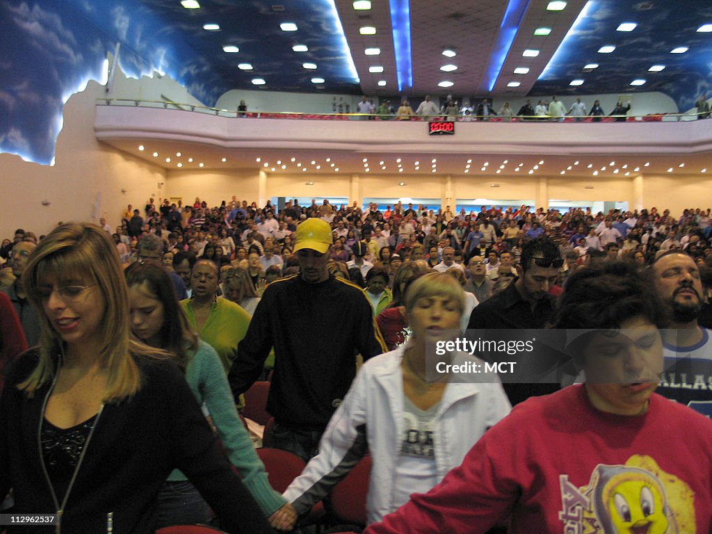 Worshippers pray at the Reborn in Christ Church's main templ