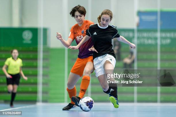Girl of DFC Westsachsen-Zwickau fighting for the ball with a girl of FC Speyer 09 during the Futsal-Cup 2019 of the B-Juniors on March 10, 2019 in...