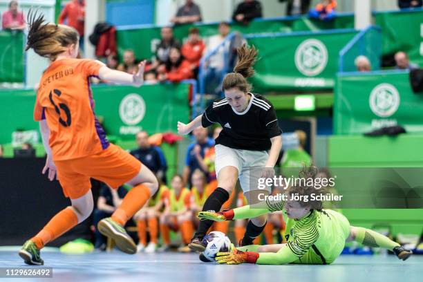 The goalkeeper of FC Speyer 09 saves against a girl of DFC Westsachsen-Zwickau during the Futsal-Cup 2019 of the B-Juniors on March 10, 2019 in...