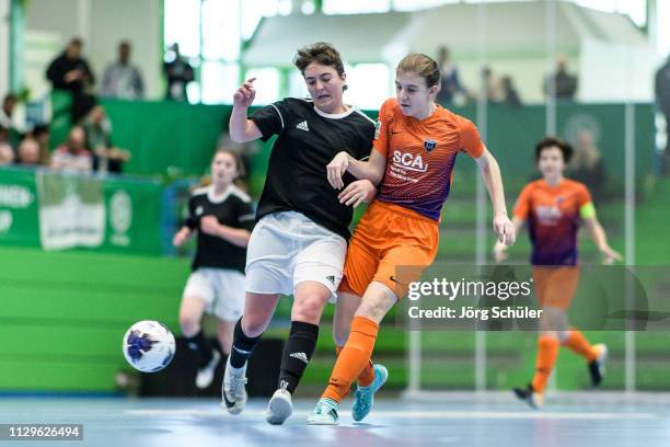 Girl of DFC Westsachsen-Zwickau fighting for the ball with a girl of FC Speyer 09 during the Futsal-Cup 2019 of the B-Juniors on March 10, 2019 in...