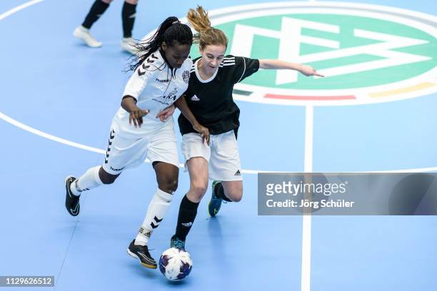 Girl of Harburger TB is challenged by a girl of DFC Westsachsen-Zwickau during the Futsal-Cup 2019 of the B-Juniors on March 10, 2019 in Wuppertal,...