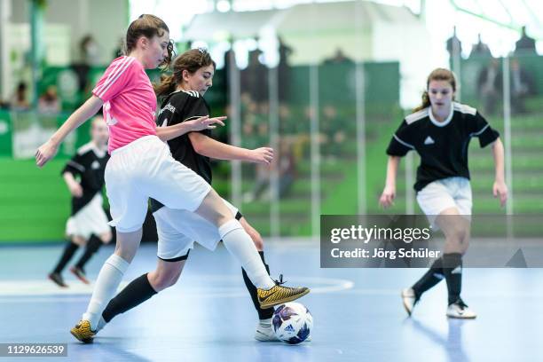 Girl of DFC Westsachsen-Zwickau is challenged by a girl of SSV Rhade during the Futsal-Cup 2019 of the B-Juniors on March 10, 2019 in Wuppertal,...