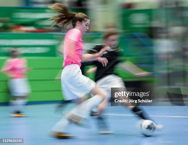 Girl of DFC Westsachsen-Zwickau is challenged by a girl of SSV Rhade during the Futsal-Cup 2019 of the B-Juniors on March 10, 2019 in Wuppertal,...