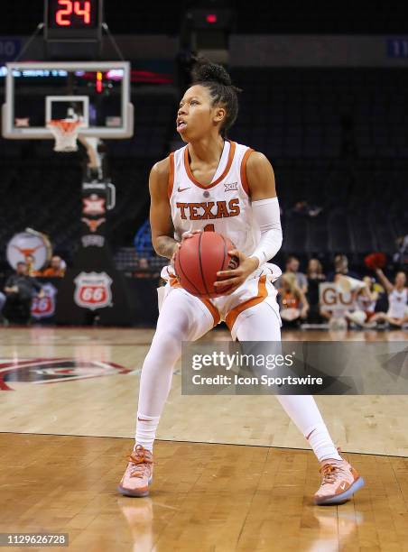 Texas Longhorns Guard Sug Sutton looks for a shot during the BIG12 Women's basketball tournament between the Texas Longhorns and the TCU Horned Frogs...