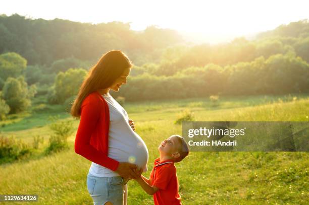 waiting for the baby. walk in the nature. - baby number 2 stock pictures, royalty-free photos & images