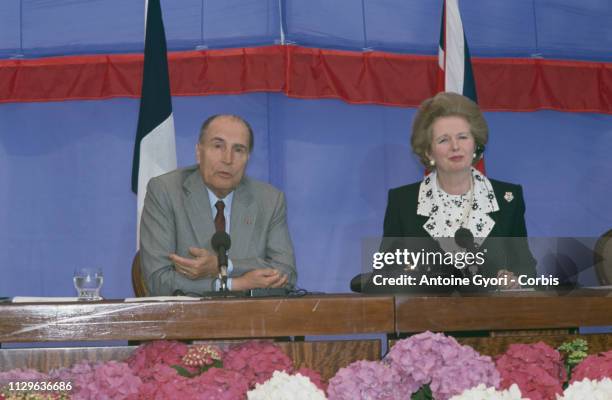 British Prime Minister Margaret Thatcher and French President Francois Mitterrand hold a Franco-British summit at Waddesdon Manor in England.