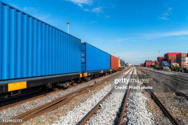 cargo train platform with freight train container at depot - rail transportation freight stock pictures, royalty-free photos & images