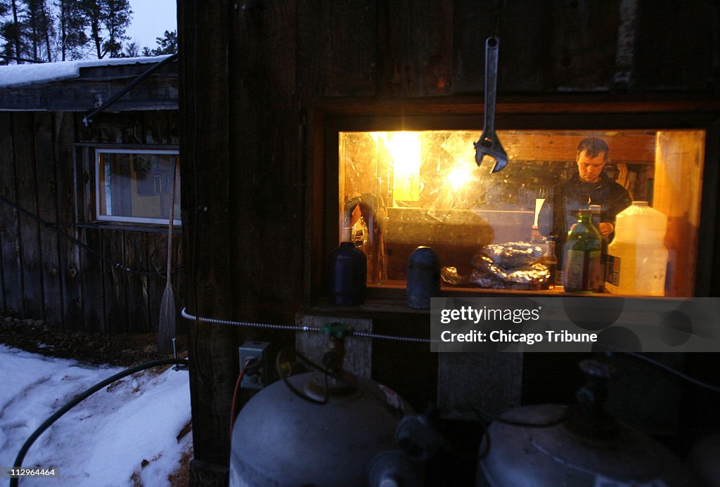 John Huston is seen through a window at the lodge in Will St