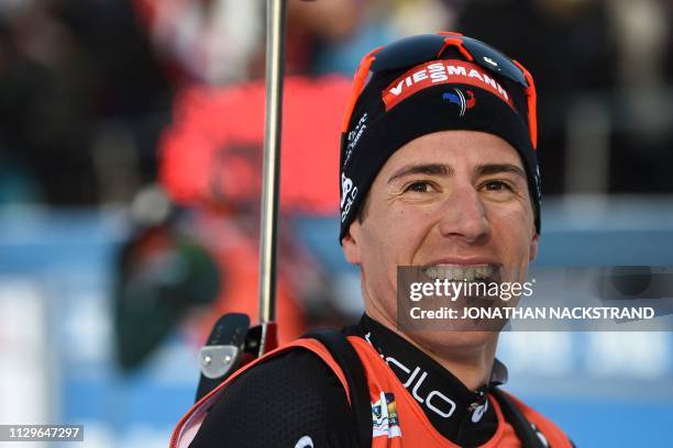 Third placed France's Quentin Fillon Maillet poses after the men's 12,5km pursuit competition at the IBU Biathlon World Championships in Ostersund,...