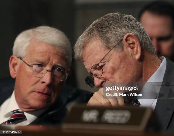 Chairman James Inhofe speaks with Sen. Michael Enzi during a Senate Armed Services Committee hearing on February 14, 2019 in Washington, DC. The...