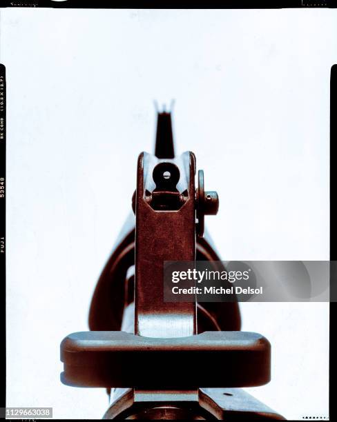 View, from the rear sight, along the barrel of an Essential Arms J-15 semi-automatic rifle, seen against a white background, New York, New York,...