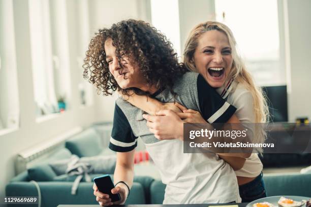 mother and teenage boy - boy hugs mother stock pictures, royalty-free photos & images