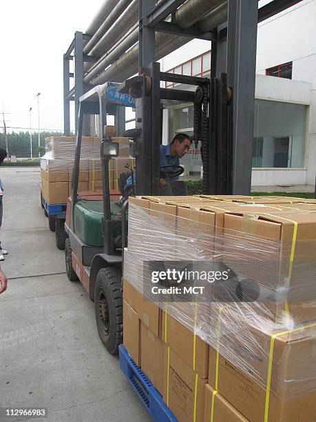 Forklift operator moves boxes of ascorbic acid, the raw ingredient for vitamin C, at a factory in Shijiazhuang, China. The Weisheng Pharmaceutical...