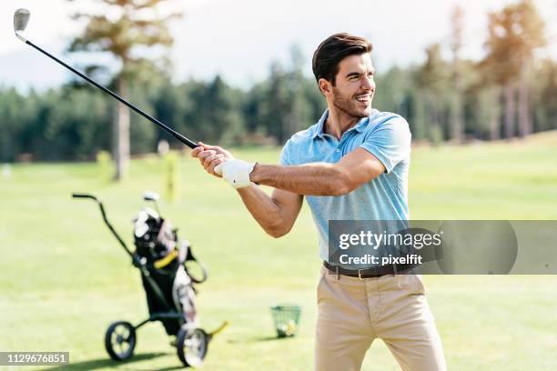 making his best shot - playing golf stock pictures, royalty-free photos & images