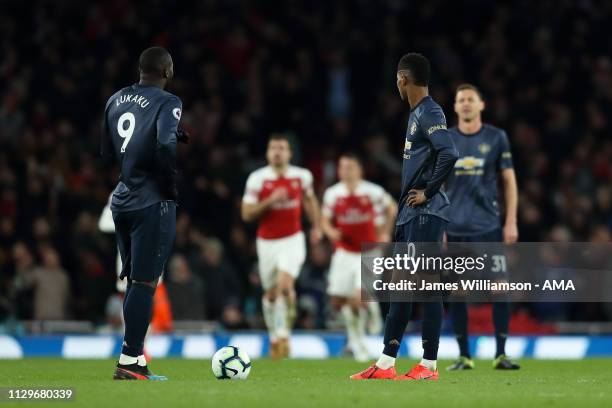 Romelu Lukaku and Marcus Rashford of Manchester United dejected after Pierre-Emerick Aubameyang of Arsenal scored a goal to make it 2-0 during the...