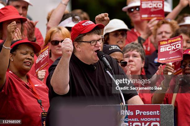 Film director Michael Moore addresses a crowd including hundreds of members of the California Nurses Association on the west steps of the California...