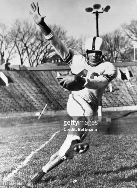 Johnny Bright, Drake University's fleet footed, 200 pound football star and 1949 champion ground gainer, retained his crown and gained 305 yards in...