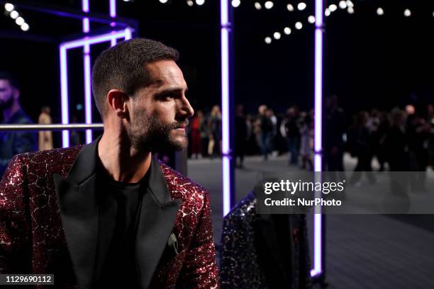 Portuguese actor Isaac Alfaiate presents a creation from the Portuguese fashion designer Nuno Gama Fall/Winter 2019/2020 collection during the Lisbon...