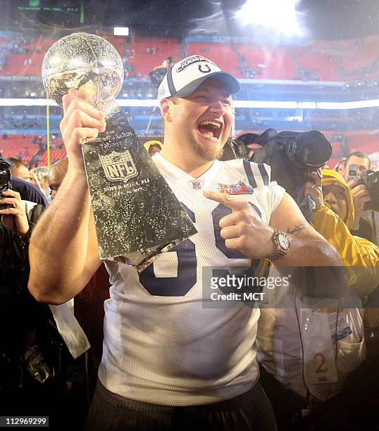 The Indianapolis Colts Matt Ulrich hoists the Lombardi Trophy to celebrate a 29-17 victory over the Chicago Bears in Super Bowl XLI in Miami,...