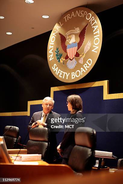 Debbie Hersman speaks with Chairman Mark V. Rosenker before an NTSB meeting on the Lexington, Kentucky crash investigation on Comair Flight 5191...