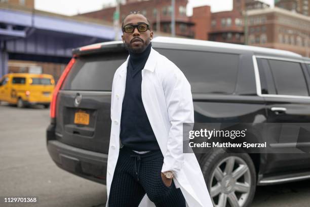 Tyrod Taylor is seen on the street during New York Fashion Week AW19 wearing BOSS on February 13, 2019 in New York City.