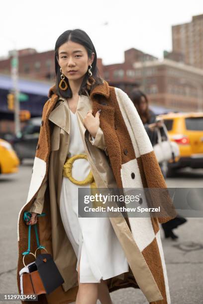 Guest is seen on the street during New York Fashion Week AW19 wearing BOSS on February 13, 2019 in New York City.