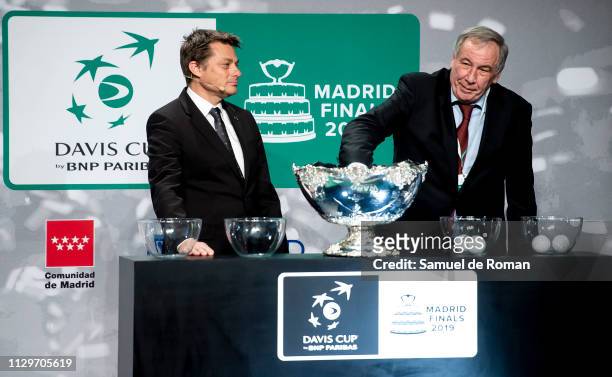Andreas Egli and Russia's Davis Cup captain Shamil Tarpischev hold the draw for the 2019 Davis Cup tennis finals on February 14, 2019 in Madrid,...