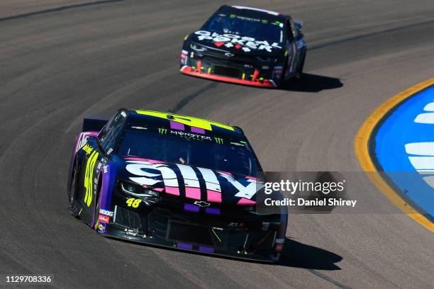 Jimmie Johnson, driver of the Ally Chevrolet, leads a pack of cars during the Monster Energy NASCAR Cup Series TicketGuardian 500 at ISM Raceway on...