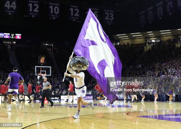 Kansas State Wildcats mascot Willie the Wildcat runs with a giant flag before a Big 12 game between the Oklahoma Sooners and Kansas State Wildcats on...