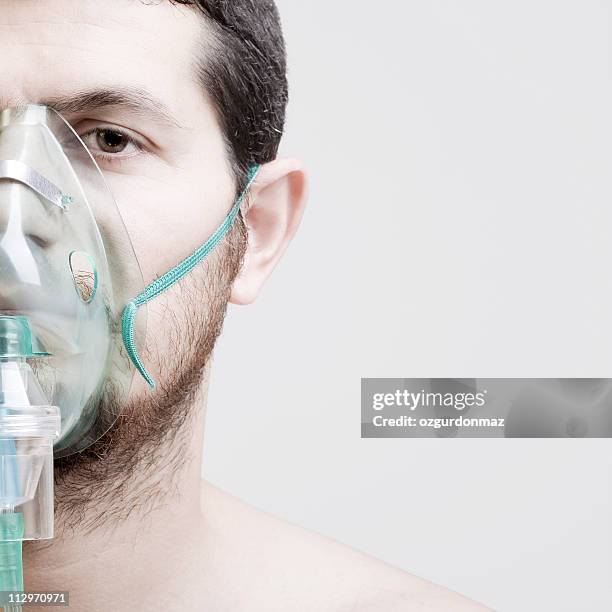young man with oxygen mask - gasmask bildbanksfoton och bilder