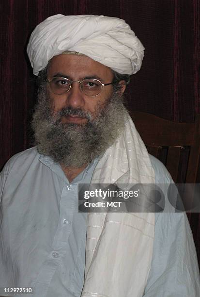 Abdul Rashid Ghazi, a senior cleric at Islamabad's Lal Masjid, sits at his desk, June 21, 2007. Ghazi has called for the installation of a hard line...