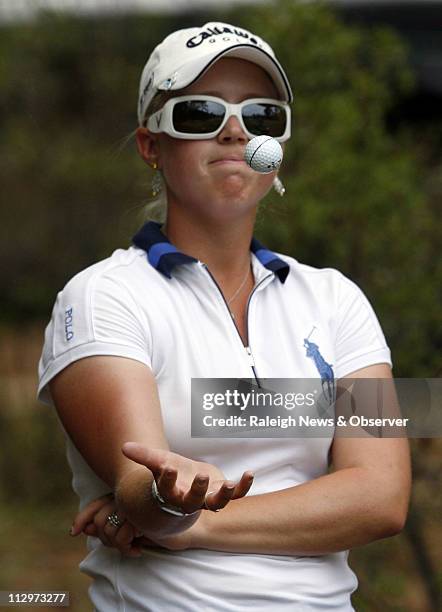 Morgan Pressel tosses the golf ball in frustration while waiting to tee off at the third hole during third round play at the U.S. Women's Open at...