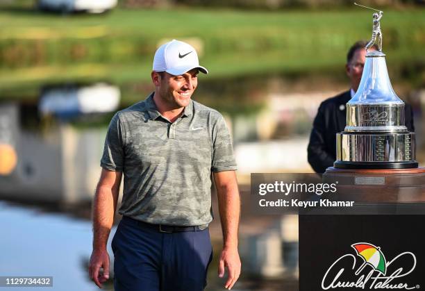 Francesco Molinari of Italy smiles during the trophy ceremony following his two stroke victory in the final round of the Arnold Palmer Invitational...