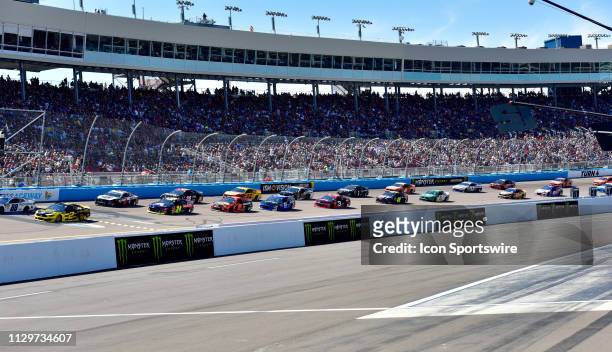 Field of race cars head for the green flag for start of the race during the Monster Energy NASCAR Cup Series - TicketGuardian 500 on March 10, 2019...
