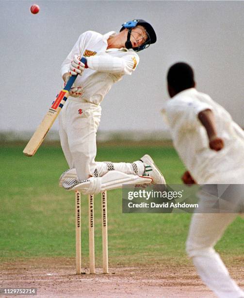 1st TEST AT SIBANA PARK JAMAICA JAN 1994. MIKE ATHERTON JUMPS AWAY FROM A BALL OFF COURTNEY WALSH.,.
